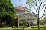 The Vimanmek Mansion is a former royal palace and is also known as the Vimanmek Teak Mansion or Vimanmek Palace.<br/><br/>

Vimanmek Mansion was built in 1900 by King Rama V (King Chulalongkorn) by having the Munthatu Rattanaroj Residence in Chuthathuj Rachathan at Ko Sichang, Chonburi, dismantled and reassembled in Dusit Garden. It was completed on March 27, 1901 and used as a royal palace by King Rama V for five years.<br/><br/>

In 1982 Queen Sirikit asked permission of King Rama IX (Bhumibol Adulyadej) to renovate Vimanmek Palace for use as a museum to commemorate King Rama V by displaying his photographs, personal art and handicrafts.<br/><br/>

The palace is the world's largest golden teakwood mansion.